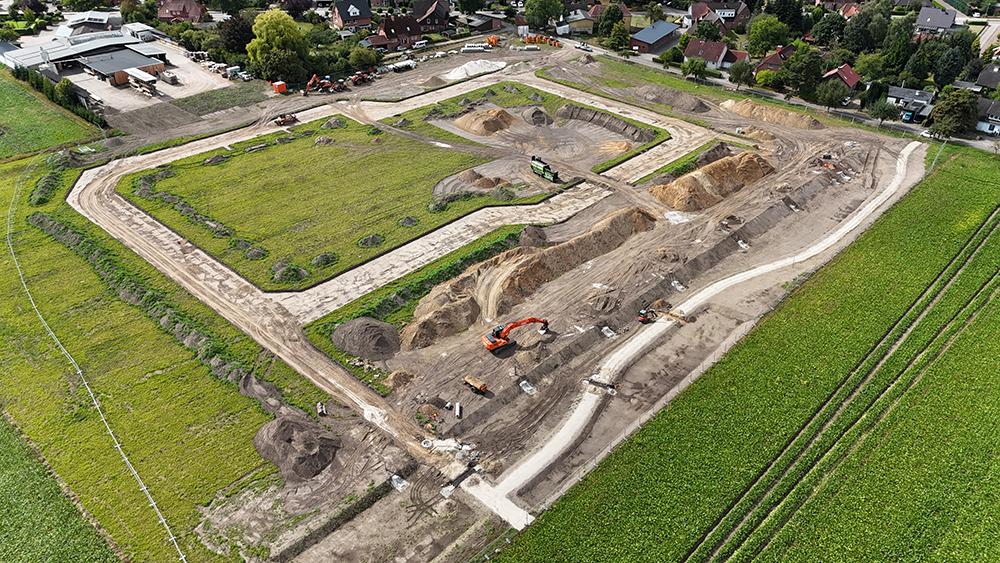 Bild Neubau Eigentumswohnungen und Häuser Auenfeld Garstedt: Vogelperspektive auf die Baustelle
