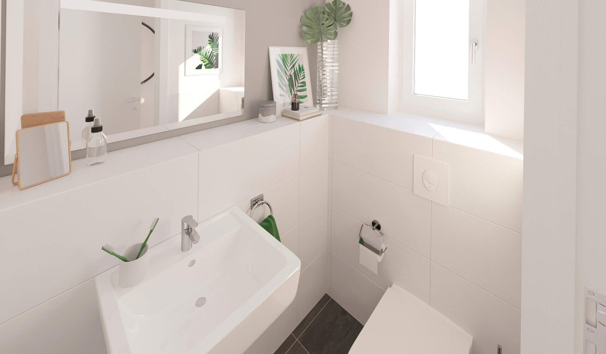 Modern gefliestes Gäste-WC im Erdgeschoss