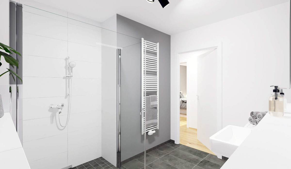 Ein modern gefliestes Badezimmer mit bodengleicher Dusche